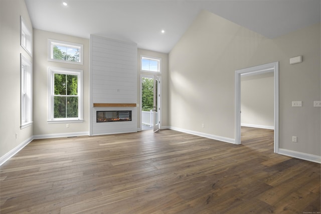 65 Soderman Way Unit 65, Cheshire, CT 06410 - unfurnished living room featuring a fireplace, dark wood-style floors, baseboards, high vaulted ceiling, and recessed lighting