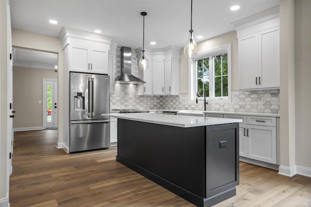 65 Soderman Way Unit 65, Cheshire, CT 06410 - kitchen featuring high end fridge, wall chimney range hood, backsplash, baseboards, and ornamental molding
