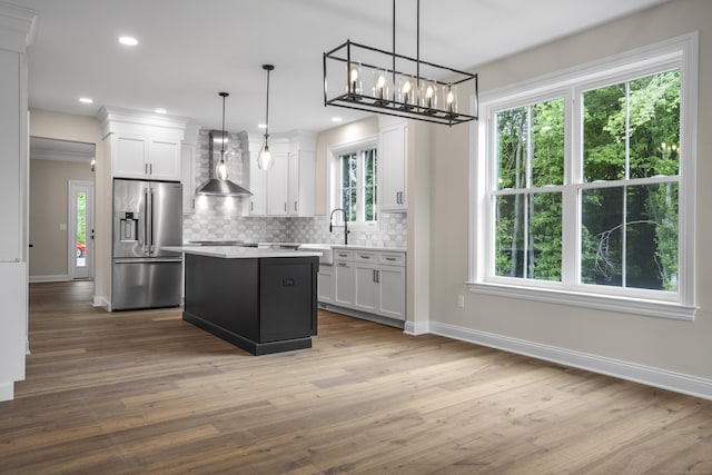 65 Soderman Way Unit 65, Cheshire, CT 06410 - kitchen featuring high end fridge, wall chimney range hood, baseboards, backsplash, and recessed lighting