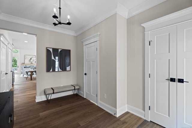 65 Soderman Way Unit 65, Cheshire, CT 06410 - hall featuring crown molding, dark wood-style floors, and a chandelier