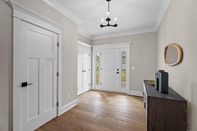 65 Soderman Way Unit 65, Cheshire, CT 06410 - foyer featuring a chandelier, wood finished floors, and crown molding