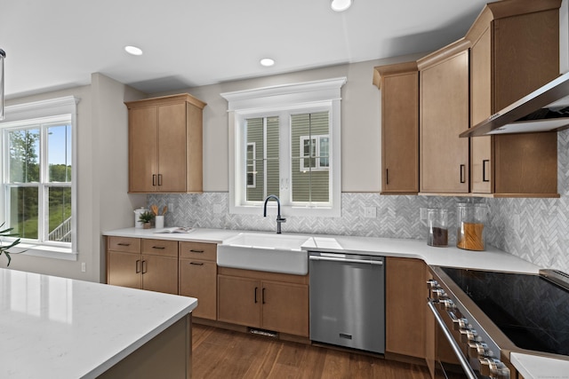 65 Soderman Way Unit 65, Cheshire, CT 06410 - kitchen with appliances with stainless steel finishes, wall chimney range hood, dark wood-type flooring, backsplash, and recessed lighting
