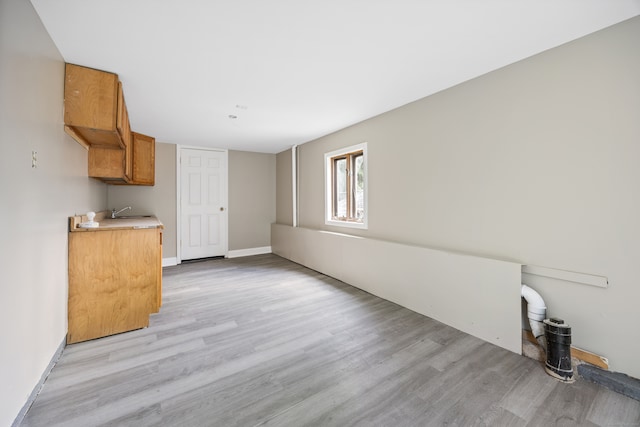 interior space featuring light hardwood / wood-style floors and sink