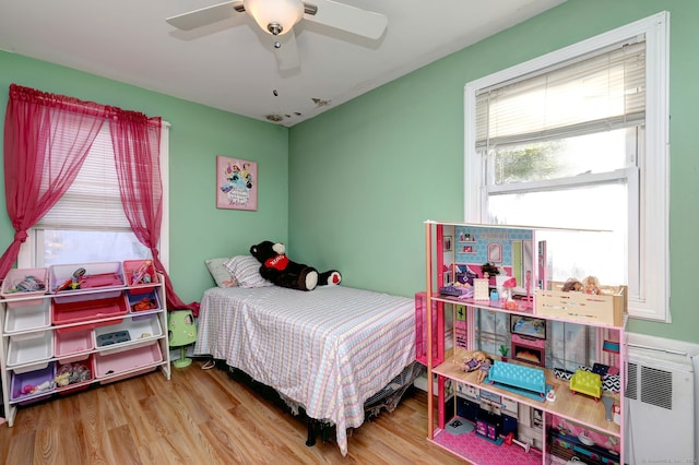 bedroom featuring ceiling fan and wood-type flooring