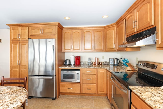 199 Pine Hollow Rd, Killingly, CT 06241 - kitchen featuring stainless steel appliances, under cabinet range hood, light stone countertops, recessed lighting, and light tile patterned flooring