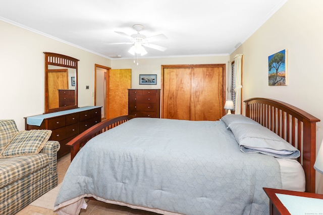 bedroom with a closet, ceiling fan, crown molding, and tile patterned flooring