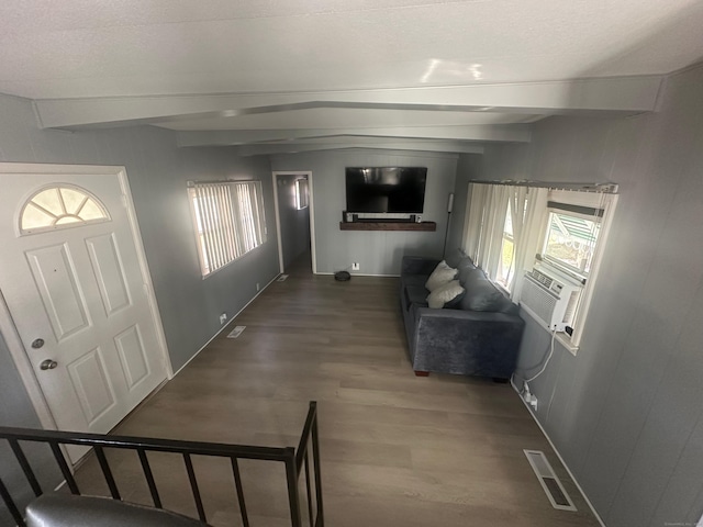 entryway with beam ceiling and wood-type flooring