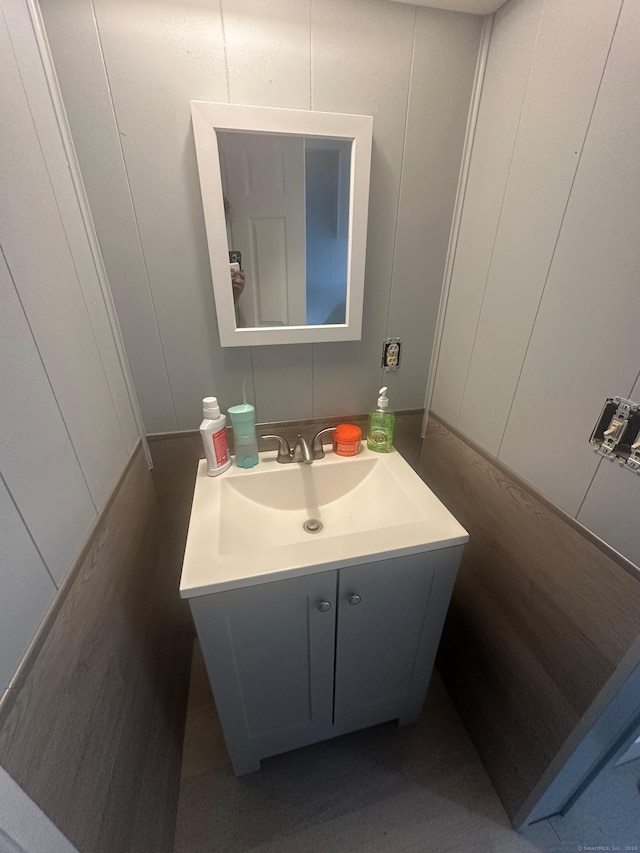 bathroom featuring vanity and wood-type flooring