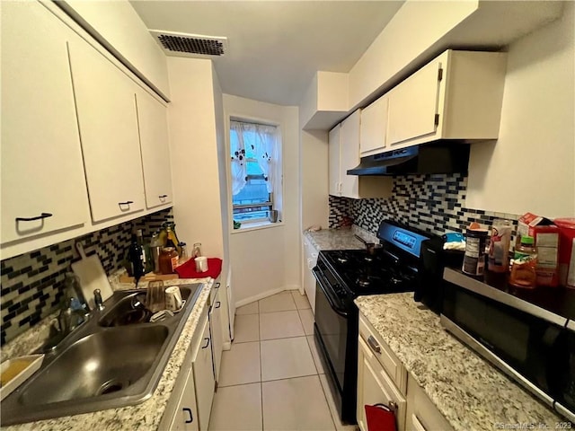 kitchen featuring backsplash, black range with gas cooktop, sink, light tile patterned floors, and white cabinets