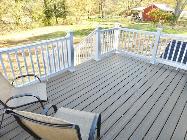 deck featuring a yard