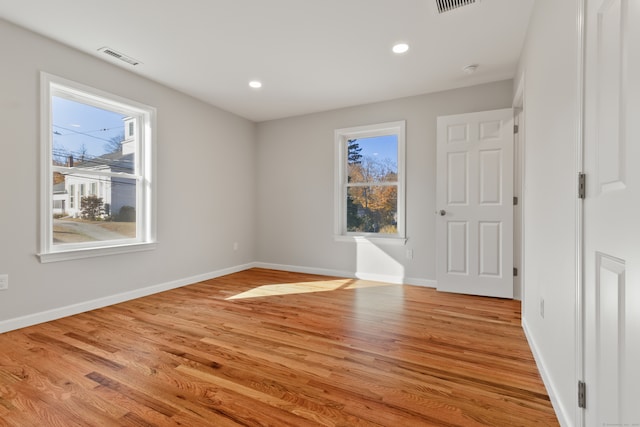 unfurnished room featuring light wood-type flooring