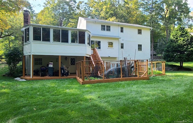 back of property with a yard and a sunroom