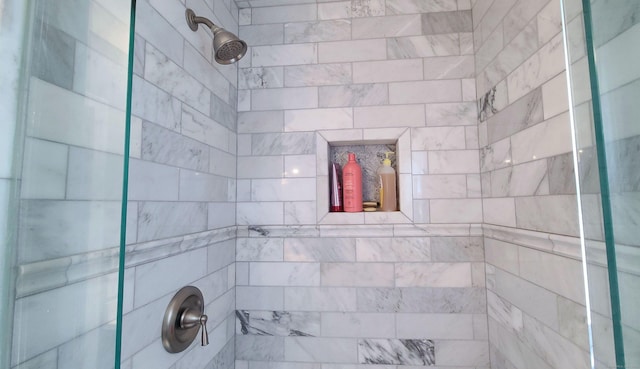 bathroom with tiled shower