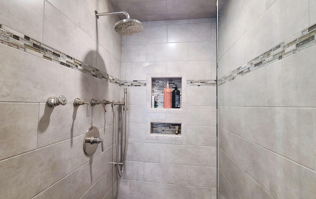 bathroom with tiled shower