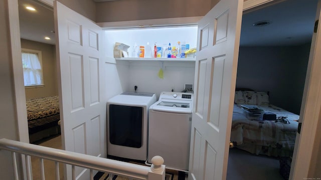 washroom with washer and clothes dryer