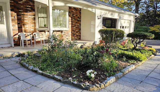 view of exterior entry featuring a garage