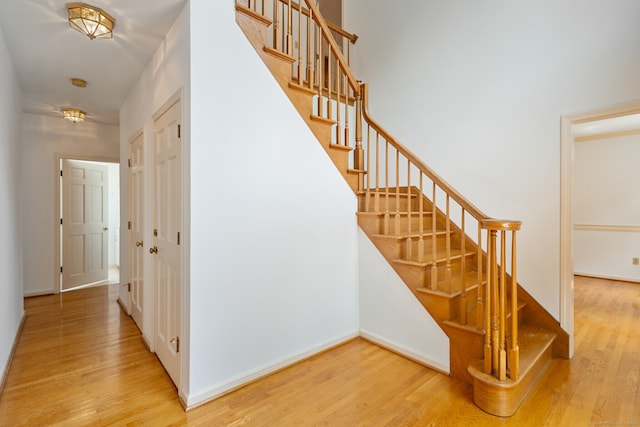 staircase featuring wood-type flooring