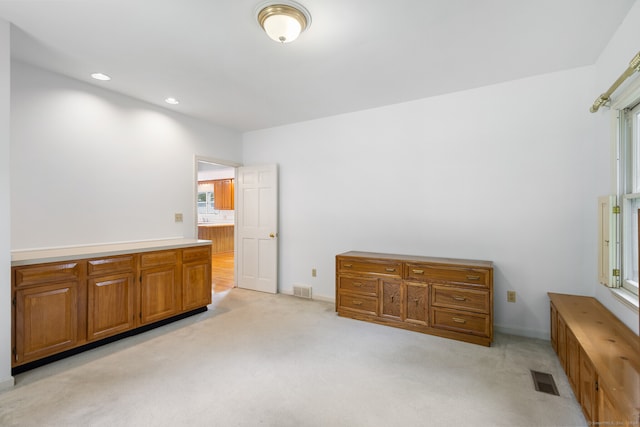 bedroom featuring light colored carpet