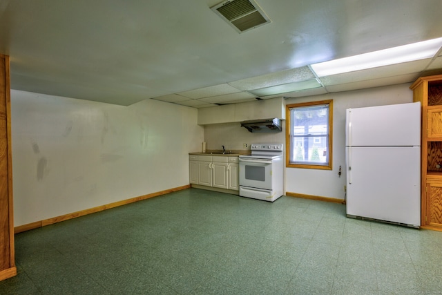 kitchen with white appliances, a paneled ceiling, extractor fan, and sink