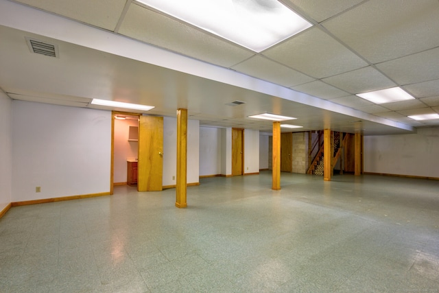 basement featuring a paneled ceiling