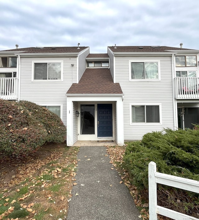 view of front of property with a balcony