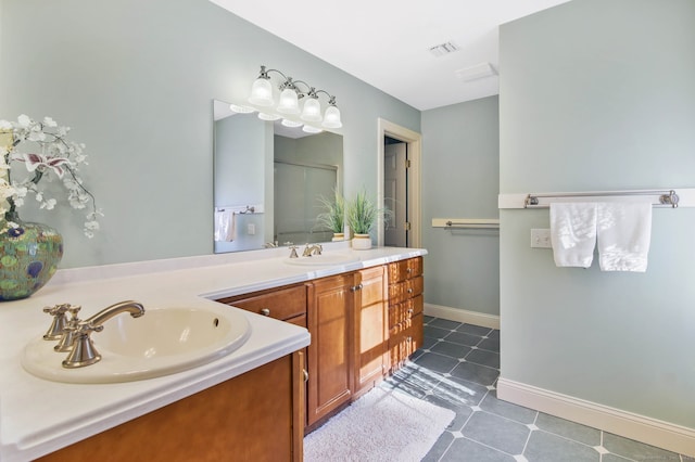 bathroom featuring vanity and an enclosed shower