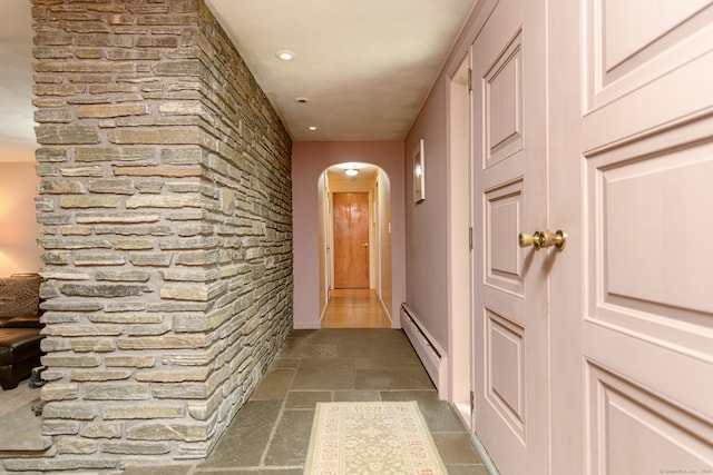 hallway featuring baseboard heating