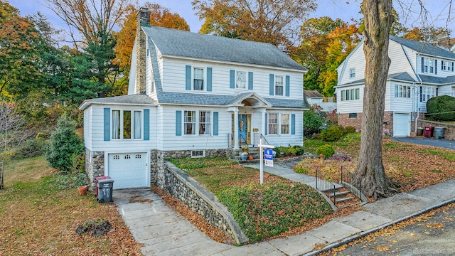 view of front of property with a garage