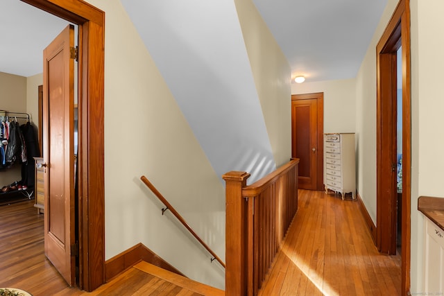 corridor with light wood-type flooring