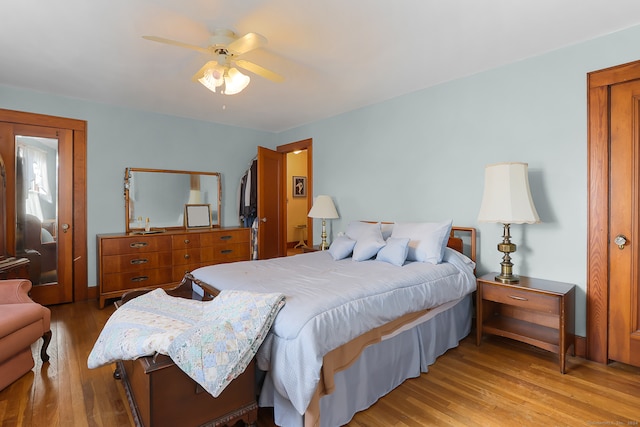 bedroom featuring light wood-type flooring and ceiling fan