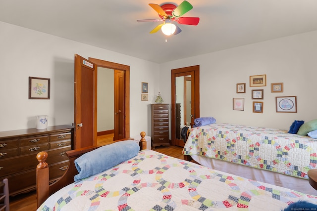 bedroom with hardwood / wood-style flooring and ceiling fan