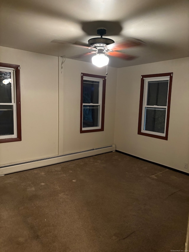 unfurnished room featuring carpet, a baseboard heating unit, and ceiling fan