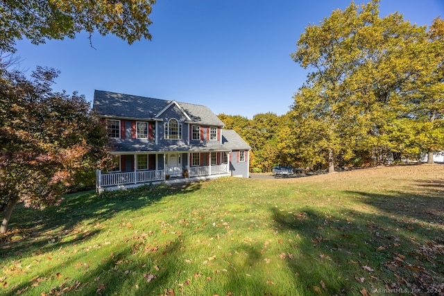 view of front of property with covered porch and a front yard