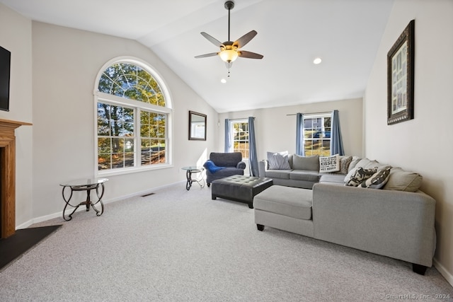 carpeted living room featuring ceiling fan and vaulted ceiling