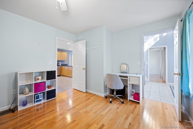 office featuring ceiling fan and light wood-type flooring