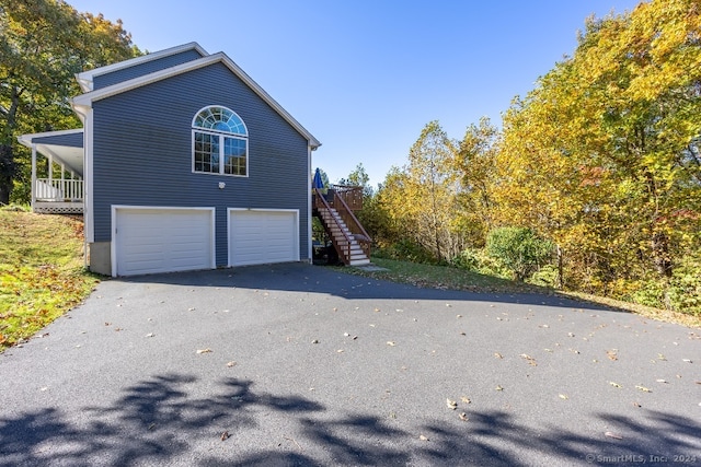 view of side of home featuring a garage