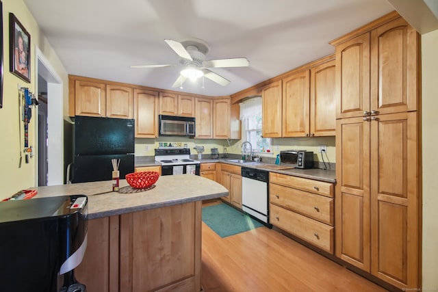 kitchen featuring white appliances, ceiling fan, light hardwood / wood-style flooring, and sink