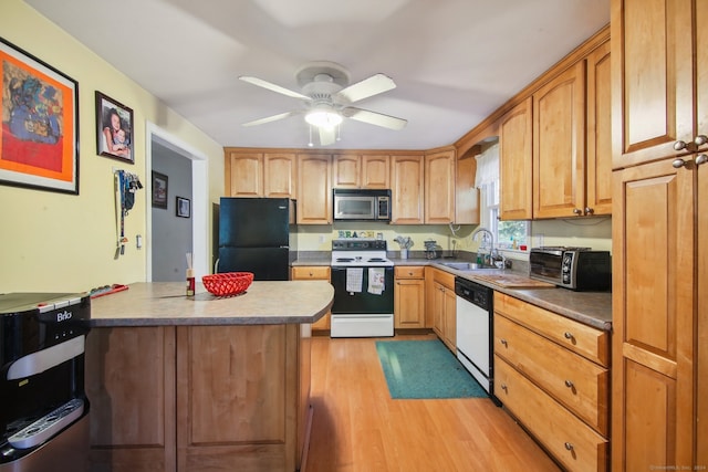 kitchen with light hardwood / wood-style floors, ceiling fan, sink, and white appliances