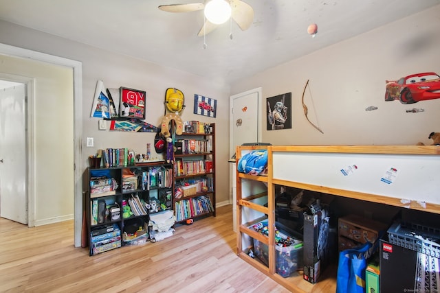 bedroom with light hardwood / wood-style flooring and ceiling fan