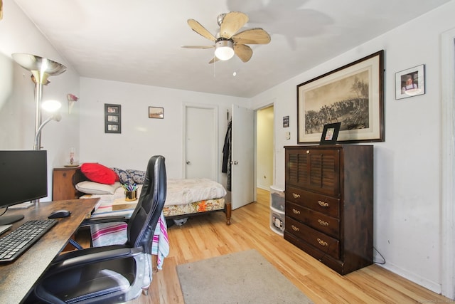 office area with light hardwood / wood-style floors and ceiling fan