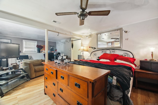 bedroom featuring ceiling fan and light hardwood / wood-style flooring