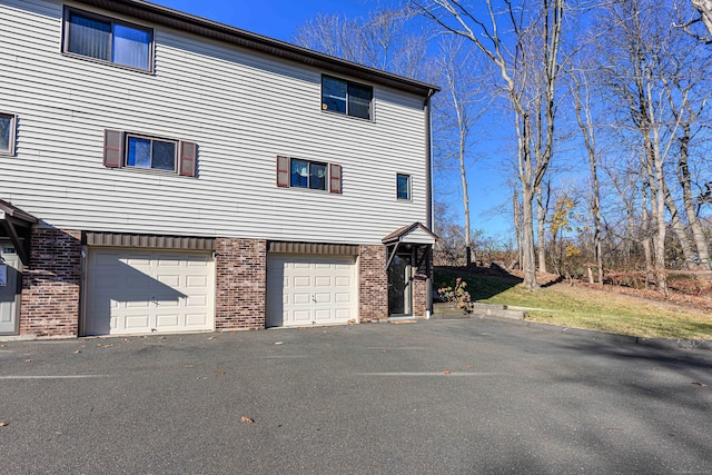 view of side of home with a garage