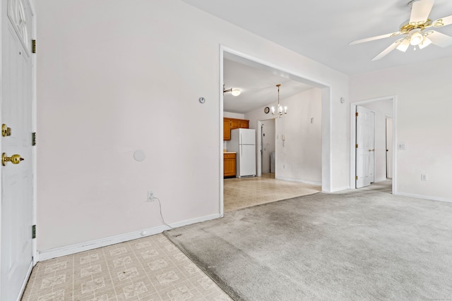 unfurnished living room with light colored carpet and ceiling fan with notable chandelier