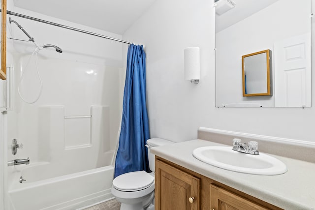 full bathroom with vanity, shower / tub combo with curtain, and toilet