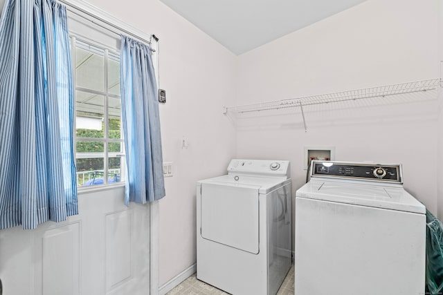 clothes washing area with washing machine and clothes dryer