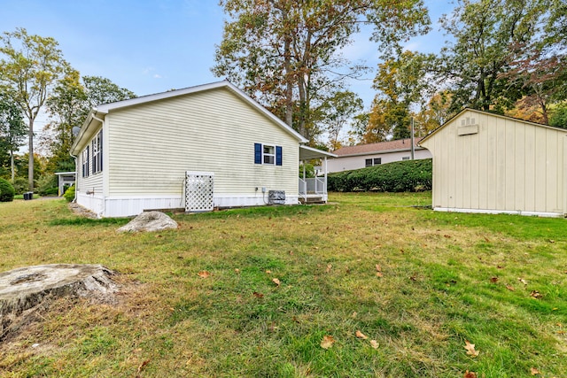 view of side of home featuring a yard