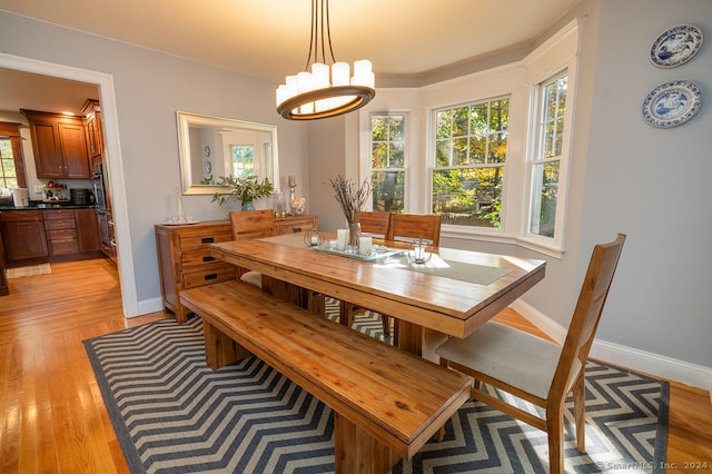 dining space with light hardwood / wood-style floors