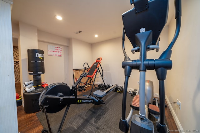 workout area featuring dark hardwood / wood-style floors