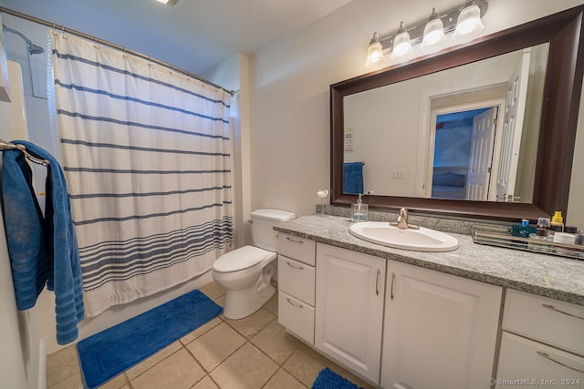 bathroom featuring vanity, toilet, and tile patterned flooring