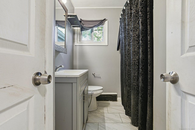 bathroom featuring vanity and toilet